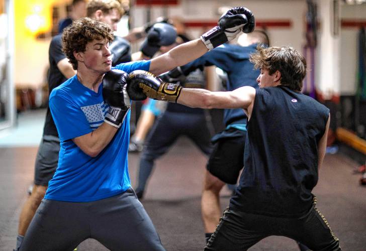 Ritchie Philbrick fends off his brother Ronnieâs punches during their boxing class at Averill's Boxing in downtown Concord on March 7, 2024.