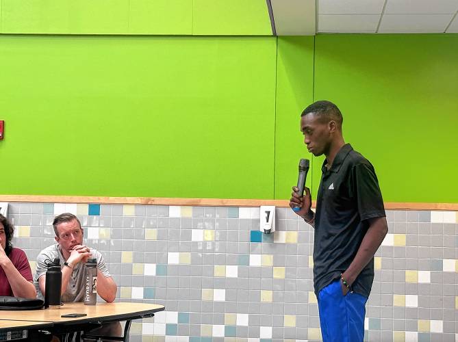 Organizer Fisto Ndayishimiye speaks at Juneteenth event.
