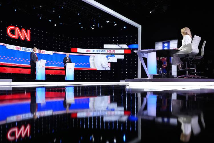 President Joe Biden, on stage at right, and Republican presidential candidate former President Donald Trump, left, participate in a presidential debate hosted by CNN June 27 in Atlanta. At far right is CNN moderator Dana Bash. President Joe Biden, on stage at right, and Republican presidential candidate former President Donald Trump, left, participate in a presidential debate hosted by CNN June 27 in Atlanta. At far right is CNN moderator Dana Bash.