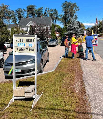 A voter information sign in front of Allenstown Elementary School on election day.