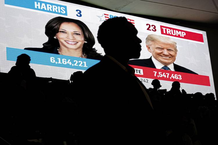 Howard University students watch live election results during a watch party near an election night event for Democratic presidential nominee Vice President Kamala Harris at Howard University in Washington, Tuesday, Nov. 5, 2023. (AP Photo/Nathan Howard)