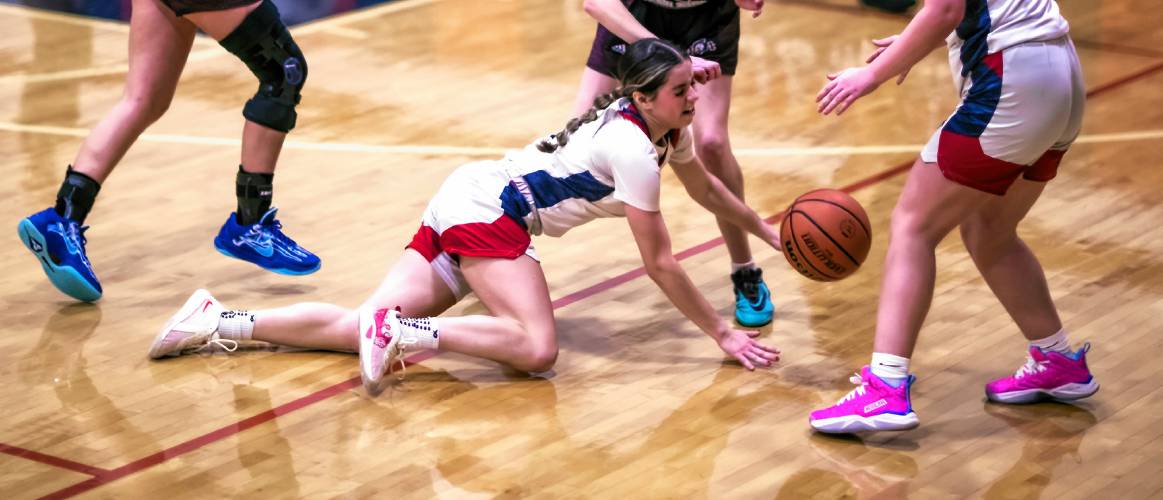Pittsfield point guard Addison Clark falls chasing a ball during the second half against Portsmouth Christian Academy on Tuesday night.