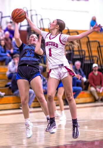 Concord Christian guard Lilli Carlile goes up against Concord High guard Abigail Lash during the second quarter on Friday.