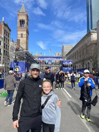 Keith Lundquist, a Hopkinton resident, and his daughter, Ella, at the 128th Boston Marathon last year.