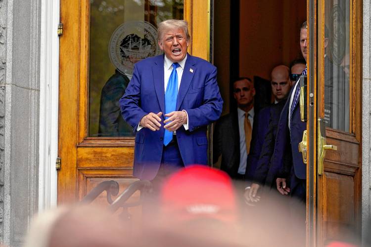 Republican presidential candidate former President Donald Trump departs after signing papers to be on the 2024 Republican presidential primary ballot at the New Hampshire Statehouse, Monday, Oct. 23, 2023, in Concord, N.H. (AP Photo/Charles Krupa)