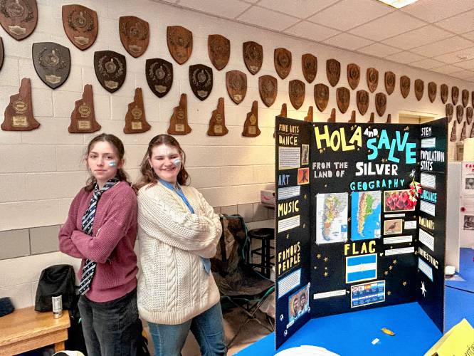 Sophomores Lily Rayne and Brigid Kelly with the Argentina flag painted on their faces at the World Fair at Bow High School on Friday