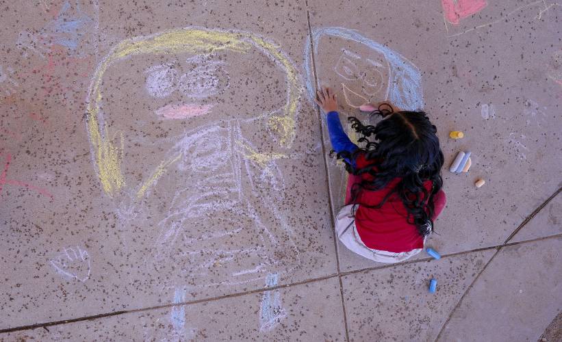 An elementary school student creates chalk art at Frye Elementary School in Chandler, Arizona in 2023. An elementary school student creates chalk art at Frye Elementary School in Chandler, Arizona in 2023.