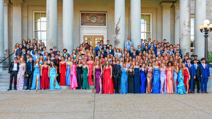 Concord High students and their dates posed for a group photo on the steps of the State House Thursday evening right before the prom at the Bank of NH Stage.