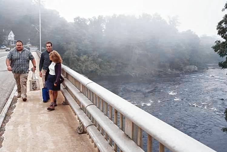 From left, Environmental Engineer Mike Hamilton of Watts Water Technologies and Upper Merrimack Monitoring Program Co-Directors Steve Landry and Michele Tremblay walk over the bridge on Central Street in Franklin after taking an E. coli sample from the Pemigewasset River on Aug. 27. From left, Environmental Engineer Mike Hamilton of Watts Water Technologies and Upper Merrimack Monitoring Program Co-Directors Steve Landry and Michele Tremblay walk over the bridge on Central Street in Franklin after taking an E. coli sample from the Pemigewasset River on Aug. 27.