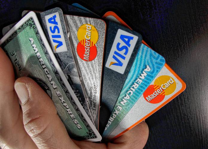 In this March 5, 2012, file photo, consumer credit cards are posed in North Andover, Mass.