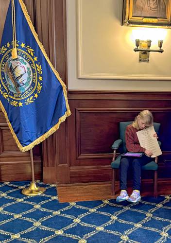 Allison Girouard holds Gov. Kelly Ayotte’s proclamation recognizing February 15 as International Angelman Day. Allison Girouard holds Gov. Kelly Ayotte’s proclamation recognizing February 15 as International Angelman Day.