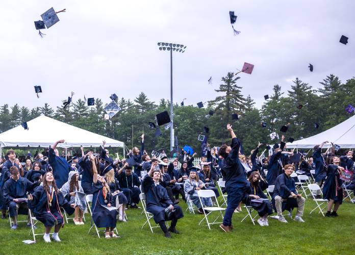Merrimack Valley graduates throw up their caps at the conclusion of the ceremony on Saturday, June 7, 2025.