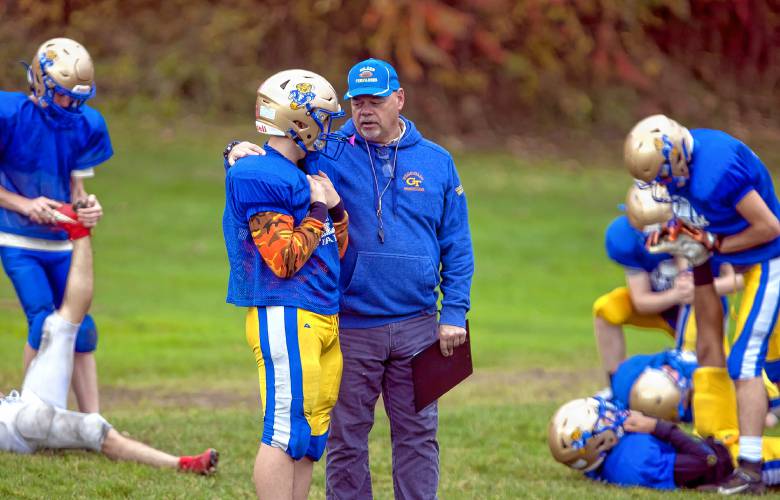 Franklin head football coach Tim Snow talks with player Ryan Mango during practice at the high school on Tuesday, October 24, 2023.