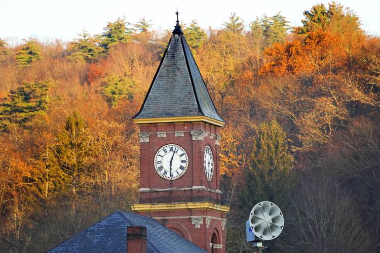 The broken clock on Town Hall is seen Thursday, Nov. 16, 2023, in Hinsdale, N.H. Funds from a generous gift to the town by longtime resident Geoffrey Holt may finally lead to the clock being repaired without expense to the residents. (AP Photo/Robert F. Bukaty)
