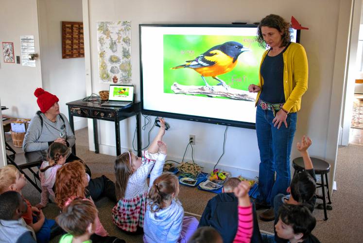 Stephanie Bowser, coordinator of the Project SEE program, teaches students about birds.