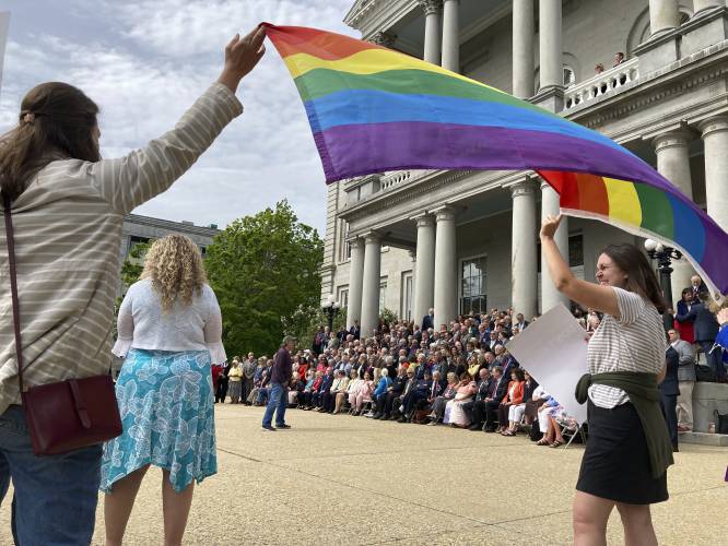 Activists gather outside the New Hampshire Statehouse, on Thursday, May 26, 2022, as the 400-member House pose for a class photo on the last day of the legislative session in Concord. Activists gather outside the New Hampshire Statehouse, on Thursday, May 26, 2022, as the 400-member House pose for a class photo on the last day of the legislative session in Concord.