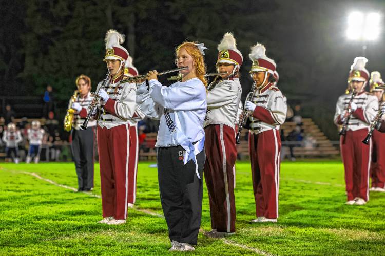 Senior cheer captain, Addison Cain, also plays the flute at halftime during the Crimson Tide's football games despite performing routines on the sidelines throughout the game.