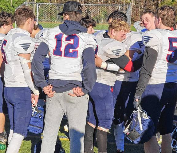 The John Stark Generals football team consoles each other after exiting in the quarterfinals on Saturday following a 34-6 loss on the road to Souhegan. John Stark made the playoffs in back-to-back seasons, continuing the program's incredible rebuild.