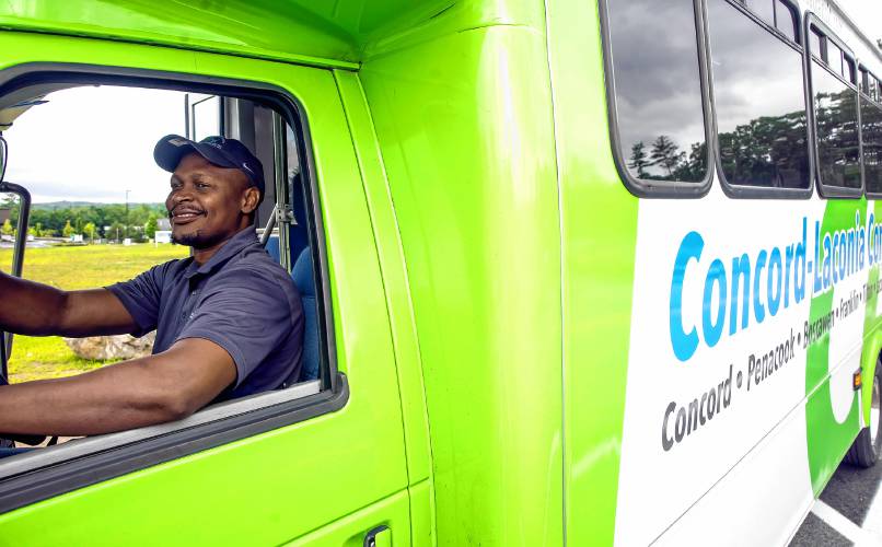 CAT bus driver Morgan Mbuyie waits for riders at the Exit 17 stop near the new Market Basket. 