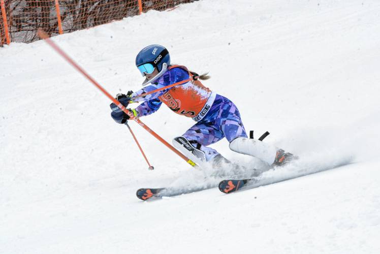 Belmont’s Ella Stevens makes her way down the slalom course at the NHIAA Division III girls’ Alpine skiing championship on Monday at Gunstock. Stevens defended her title in the slalom and finished fifth in the giant slalom to qualify for the Meet of Champions in both events.