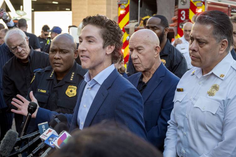 From left, Police Chief Troy Finner, Lakewood Church pastor Joel Osteen, Mayor John Whitmire and Fire Department Chief Samuel Pena, participate in a press conference during an active shooter event at Lakewood Church Sunday, Feb. 11, 2024. (Kirk Sides/Houston Chronicle via AP)