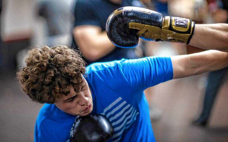 Ritchie Philbrick fends off his brother Ronnieâs punch attempts during their boxing class at Averill's Boxing in downtown Concord on March 7, 2024. They never land an actual punch during the class.