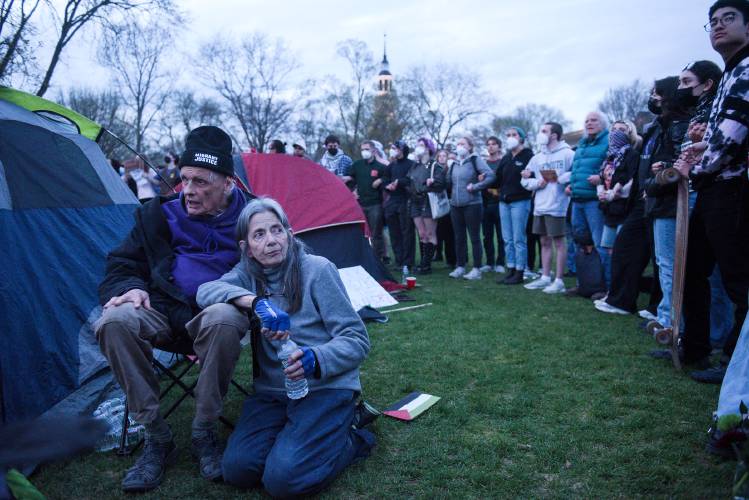 Douglas Smith, left, and Jill Wilcox, both of Sharon, set up tents on Dartmouth College Green in solidarity with students protesting the Israel-Hamas War and demanding Dartmouth College divest from companies connected to Israel, in Hanover, N.H., on Wednesday, May 1, 2024. (Valley News - James M. Patterson) Copyright Valley News. May not be reprinted or used online without permission. Send requests to permission@vnews.com.