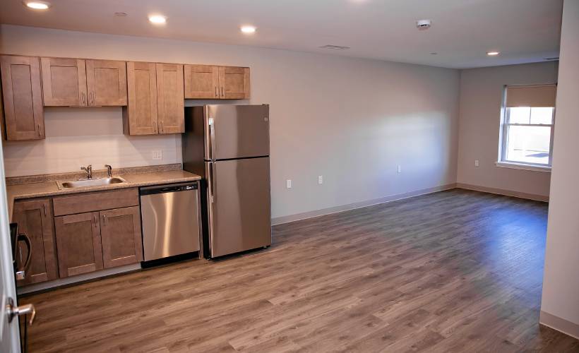 The kitchen and living room area of a one bedroom apartment at the new Davis Ridge Apartments on Sheep Davis Road in Concord.