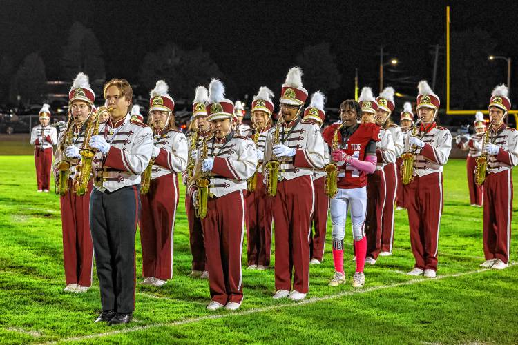 Ramon Reynolds (24), a freshman running back, plays the saxophone for the band at halftime.