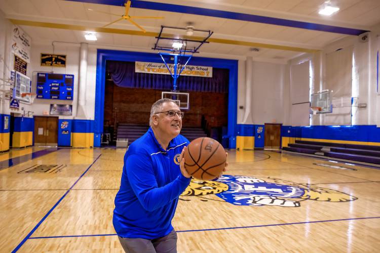 Franklin Athletic Director Dan Sylvester shoots a three-pointer inside the newly renovated high school gymnasium. For the past 11 years, the Franklin AD has transformed Franklin athletics into a competitive, respectful and successful program. Franklin recently completely renovated its gym, and after playing volleyball and basketball at the middle school gym during that time, it will play both sports in house for the first time in 30 years.
