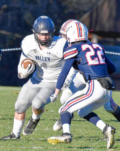 Merrimack Valley running back Colby Scheffer (1) looks to get around Plymouth’s defense on Saturday. The Pride fell to the top-ranked Bobcats, 42-7, in the Division II quarterfinals.