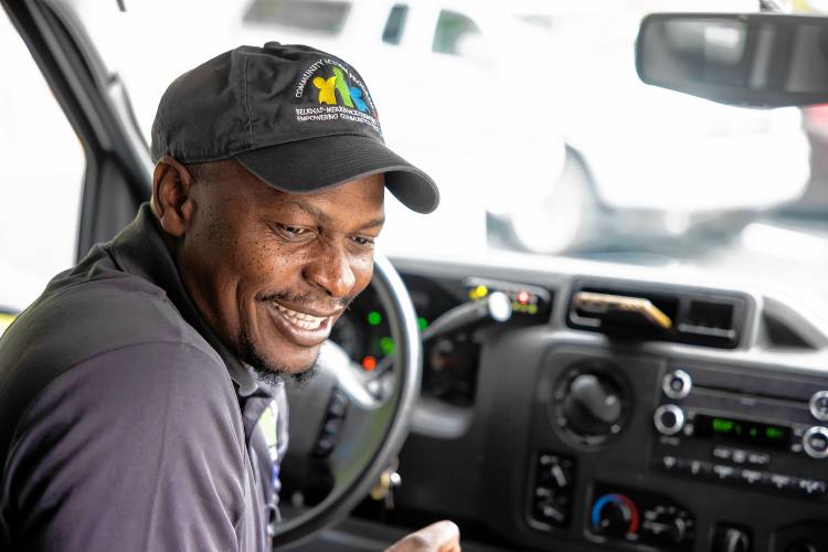 CAT bus driver Morgan Mbuyi waits for riders at the Exit 17 stop near the new Market Basket. 