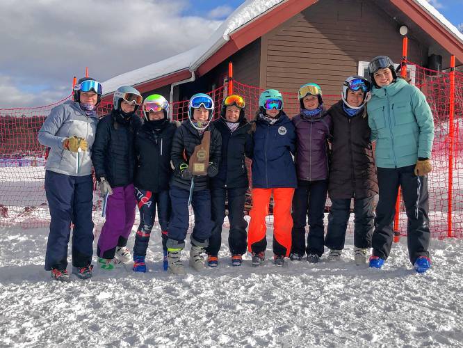 The Hopkinton girls’ Alpine ski team poses with the runner-up plaque after finishing second to Gilford at the NHIAA Division III championship at Gunstock on Monday. The Hawks skied well, with four competitors qualifying for the Meet of Champions, but ultimately finished second to an exceptionally strong Gilford team.