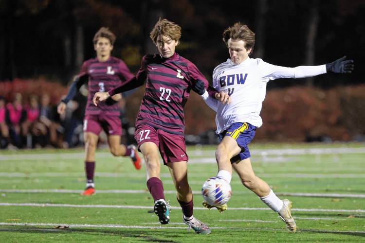 Bow’s Kody McCranie and Lebanon’s Dominic Calandrella battle for possession during Friday night’s Division II championship game at Stellos Stadium in Nashua.