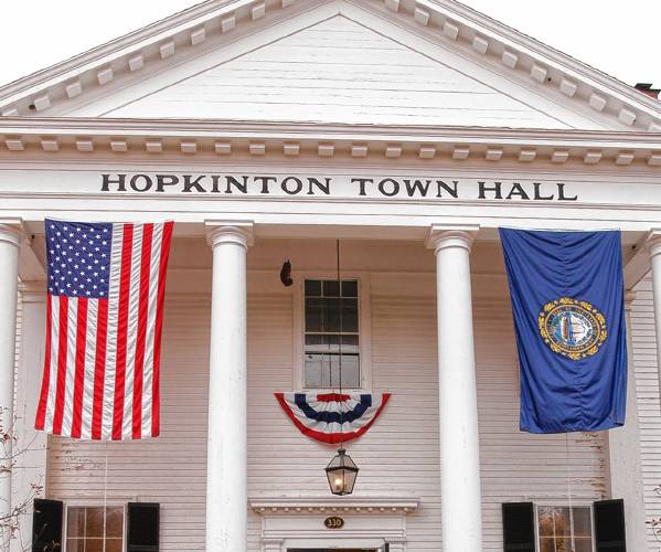 Voters stream in and out of Hopkinton Town Hall in Hopkinton, N.H. Tuesday, Nov. 2, 2004.  (AP Photo/Lee Marriner)