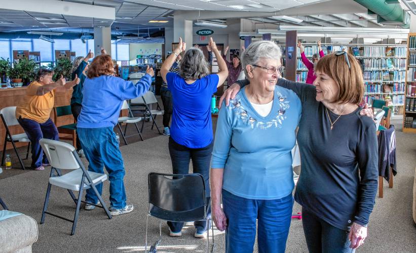 Brenda Bartlett, left, and Lawre Murphy work with seniors at their class at the Boscawen Town Library on Feb. 5.