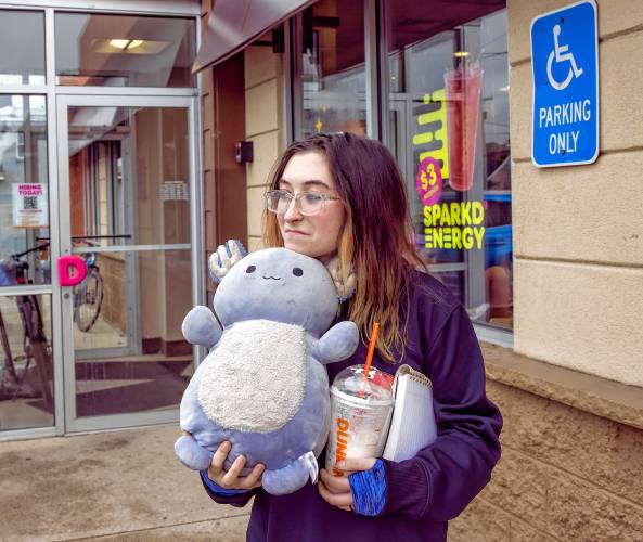 Chey Lorde holds onto her stuffed animal outside of the Dunkin’ on South Main Street as she talks about the Mountain Man who lived next to her homeless camp.