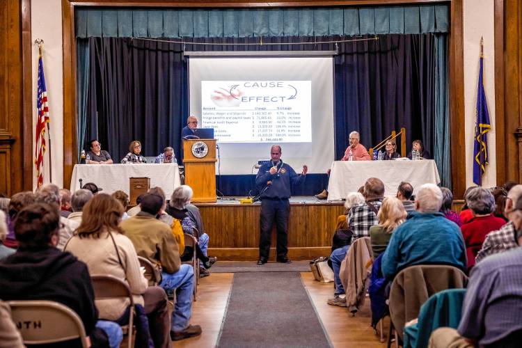 Warner Fire chief Jonathan France addresses the crowd at the town hall on Wednesday night, March 13, 2024 to discuss the budget in front of a packed house.