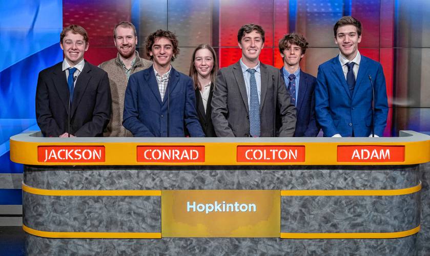 The Hopkinton High School Granite State Challenge team on set at the New Hampshire PBS studio in Durham. From left to right: Jackson Kovar, coach Liam Callahan, Conrad Mollano, Flo Dapice, Colton Murphy, Fin Murphy and Adam Richter.