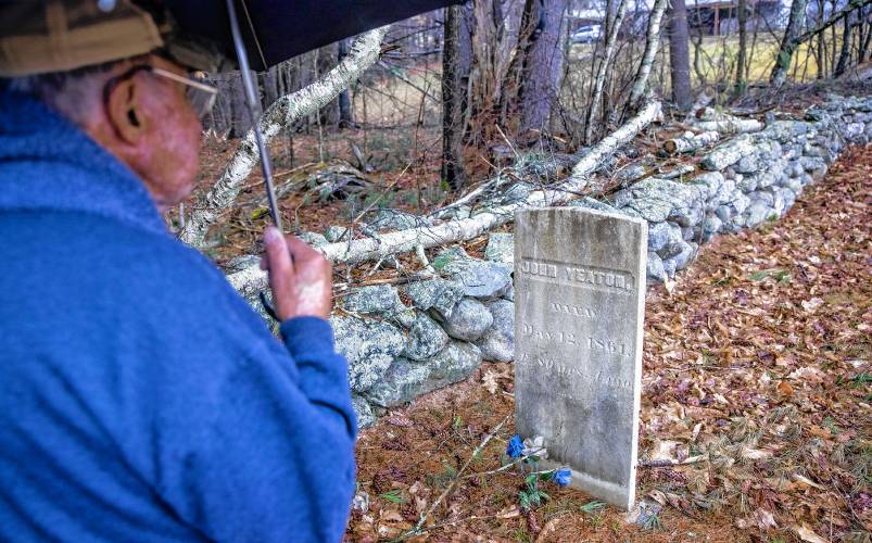 Norm Yeaton looks over the grave marker of his relative, John Yeaton who died in 1861 in the private cemetery off of Black Hill Road in Epsom on Thursday, April 11, 2024. Yeaton has taken on the arduous research project by Yeaton to understand the sheer volume of people in Epsom whose last name was the same as his--even when the name was Yeton before they added the ‘a’ sometime in the 19th century.