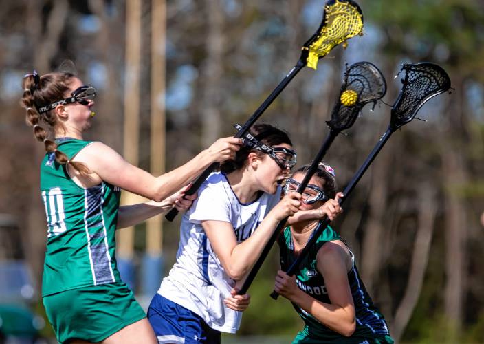 Merrimack Valley midfielder Ella Frink slips between two Kingswood defenders during Monday’s victory. The Pride is now 5-1 on the season, near the top of the D-II standings.