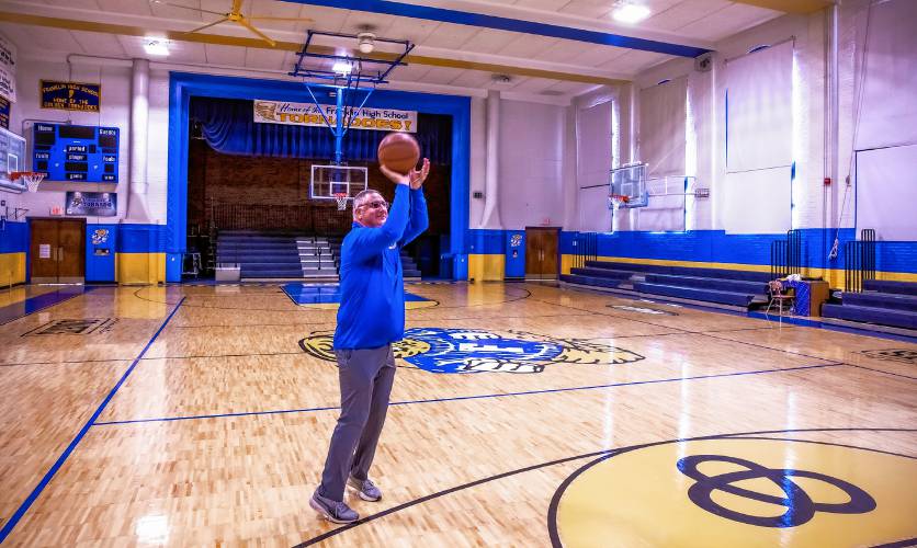 Franklin athletic director Dan Sylvester shoots a 3-pointer inside the newly renovated high school gymnasium. For the past 11 years, the Franklin AD has transformed Franklin athletics into a competitive, respectful and successful program. Franklin recently completely renovated its gym, and after playing volleyball and basketball at the middle school gym during that time, it will play volleyball and basketball in-house for the first time in 30 years. 