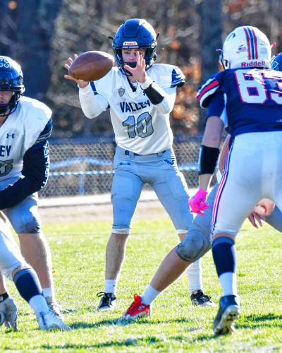 Merrimack Valley quarterback Jack Parris (10) takes a snap against the top-ranked Bobcats on the road in Plymouth on Saturday. Parris threw a TD pass to Reece Clermont, but the Pride fell to Plymouth in the Division II quarterfinals, 42-7. 
