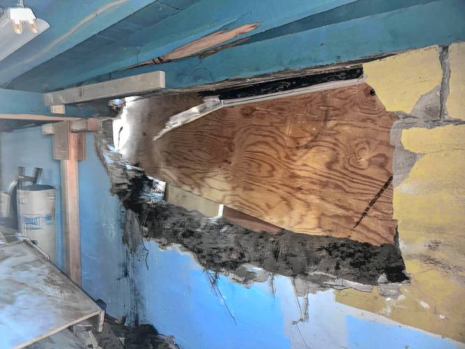 Photos from the night of the crash show damage to the Jelley's home.
