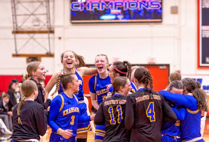 The Kearsarge girls basketball team celebrate at midcourt after they defeated the Hopkinton Hawks to win the Division III championship on Saturday night, February 24, 2024 at Keene State College.