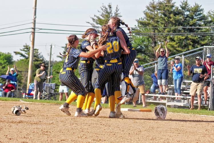 Bow softball celebrates its victory over ConVal in Saturday’s Division II quarterfinal.