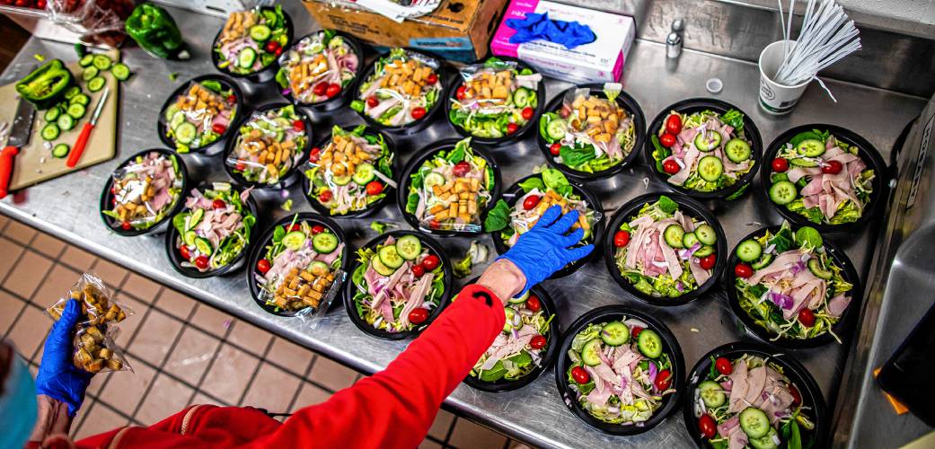 Fresh chef salads are prepared in the Concord High School kitchen. Fresh chef salads are prepared in the Concord High School kitchen.