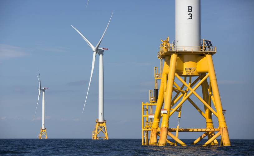 In this Aug. 15, 2016 file photo, three of Deepwater Wind's five turbines stand in the water off Block Island, R.I, the nation's first offshore wind farm. In this Aug. 15, 2016 file photo, three of Deepwater Wind's five turbines stand in the water off Block Island, R.I, the nation's first offshore wind farm.