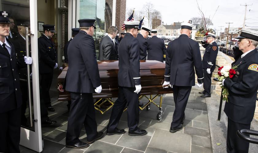 Fellow firefighters carry the casket after the funeral service for Concord firefighter Christopher “CJ “Girard at Christ the King Catholic Church on Thursday, March 13, 2025. 