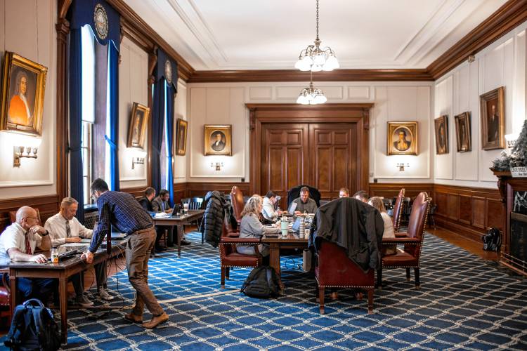 New Hampshire Secretary of State officials check the ballots matching them with the electronic tallies in the Executive Council Chambers at the State House on the morning after the primary on Wednesday, January 24, 2024.